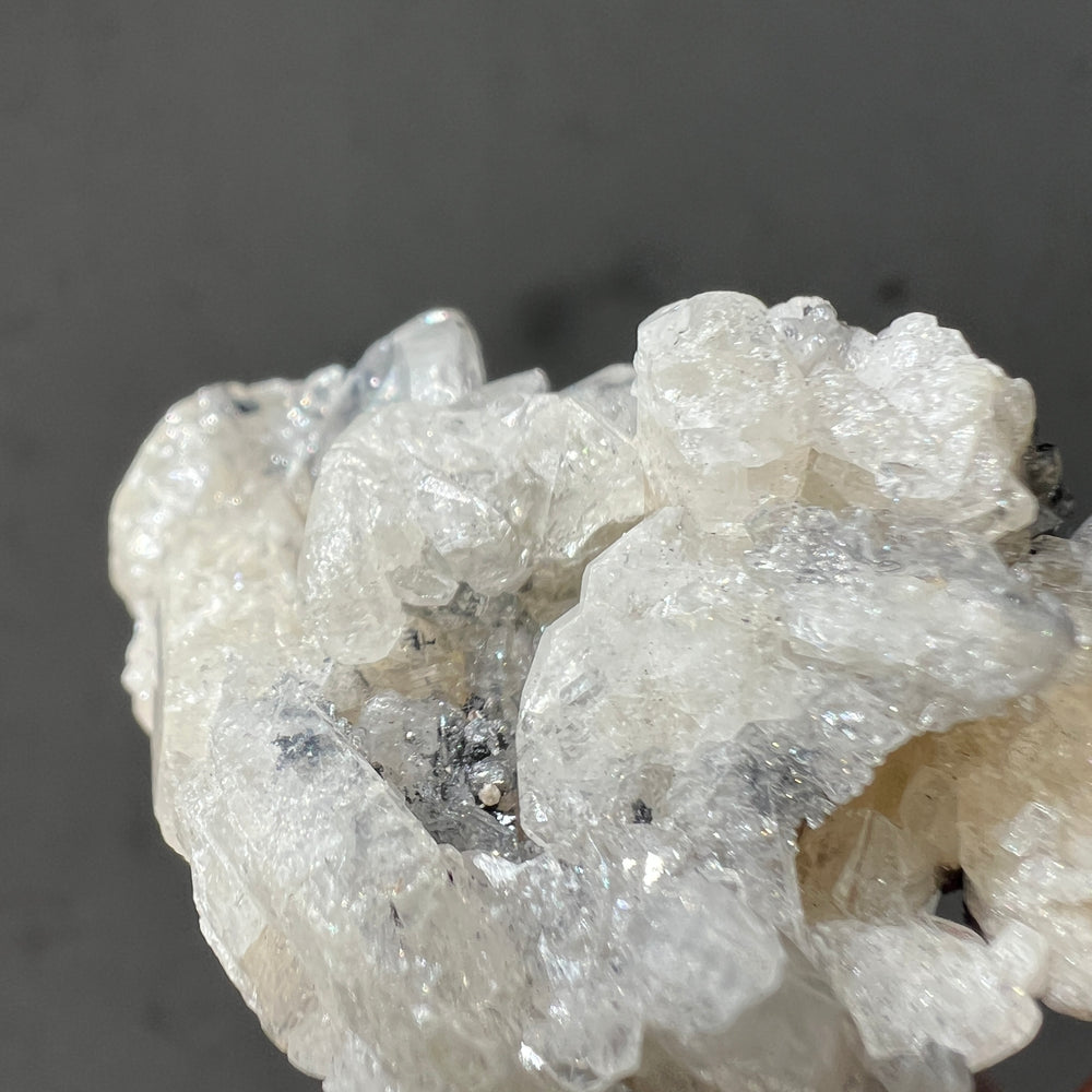 Close-up of an anglesite formation on a dark background