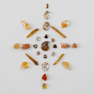 crystal grid of various crystals and minerals on a light gray background - protect your path grid